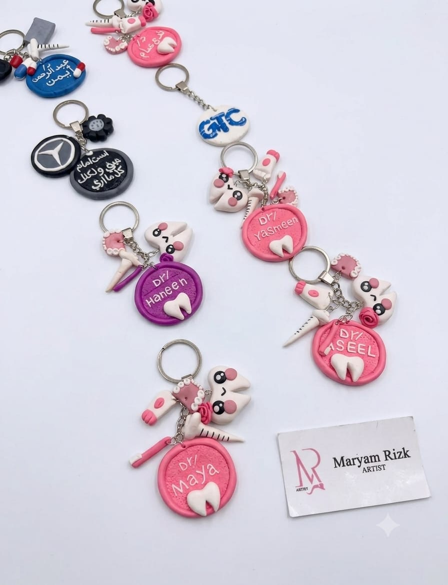 Pink and blue dental-themed keychains