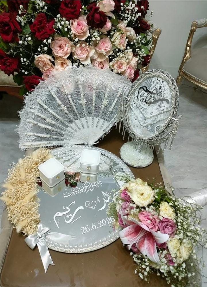 Bridal fan, mirror, and floral keepsake arrangement