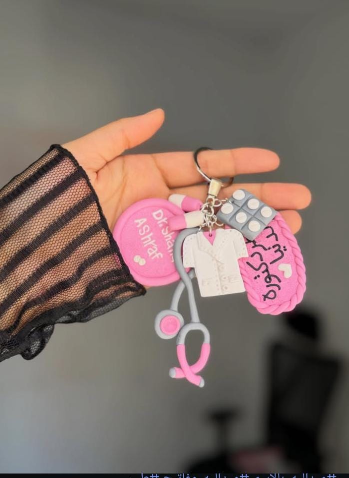 Pink and white medical-themed keychains