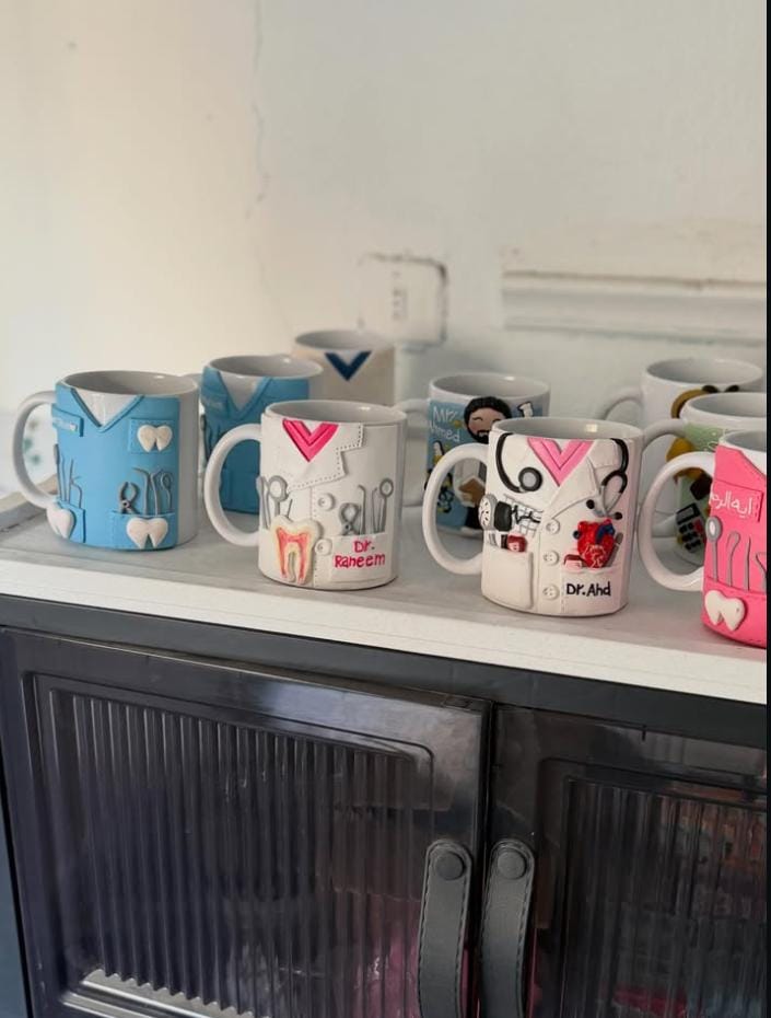 Display of custom illustrated mugs